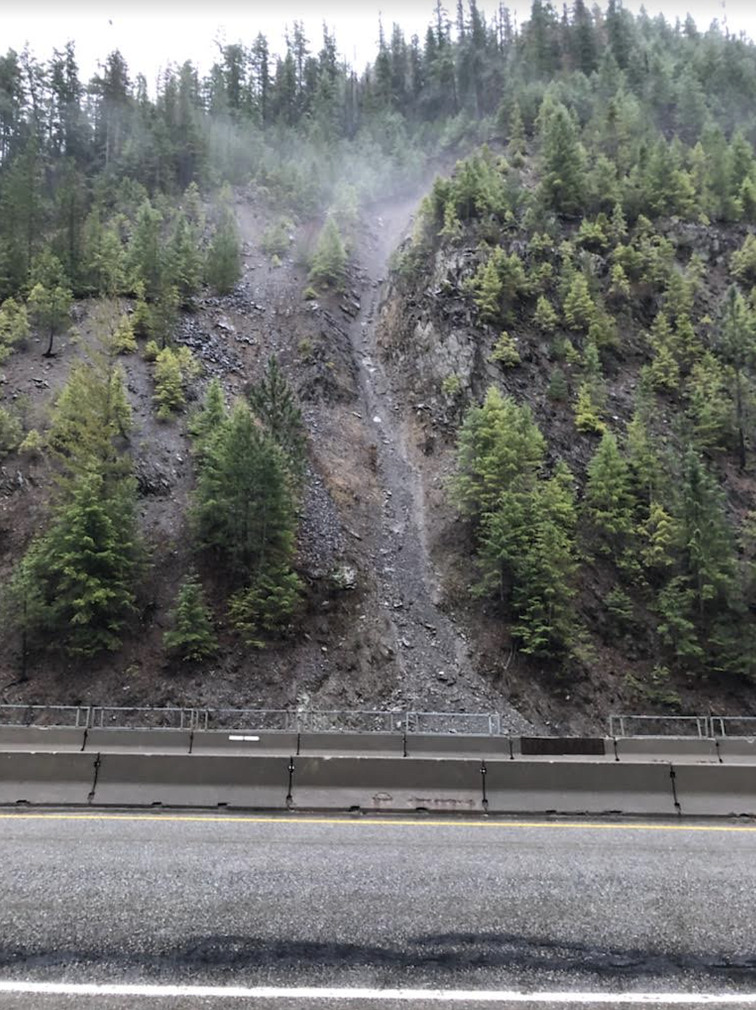 The trouble area on Interstate 90 near milepost 67 that has caused so much trouble. Falling rocks pick up speed when they fall down this hillside trench and can be launched onto the roadway.