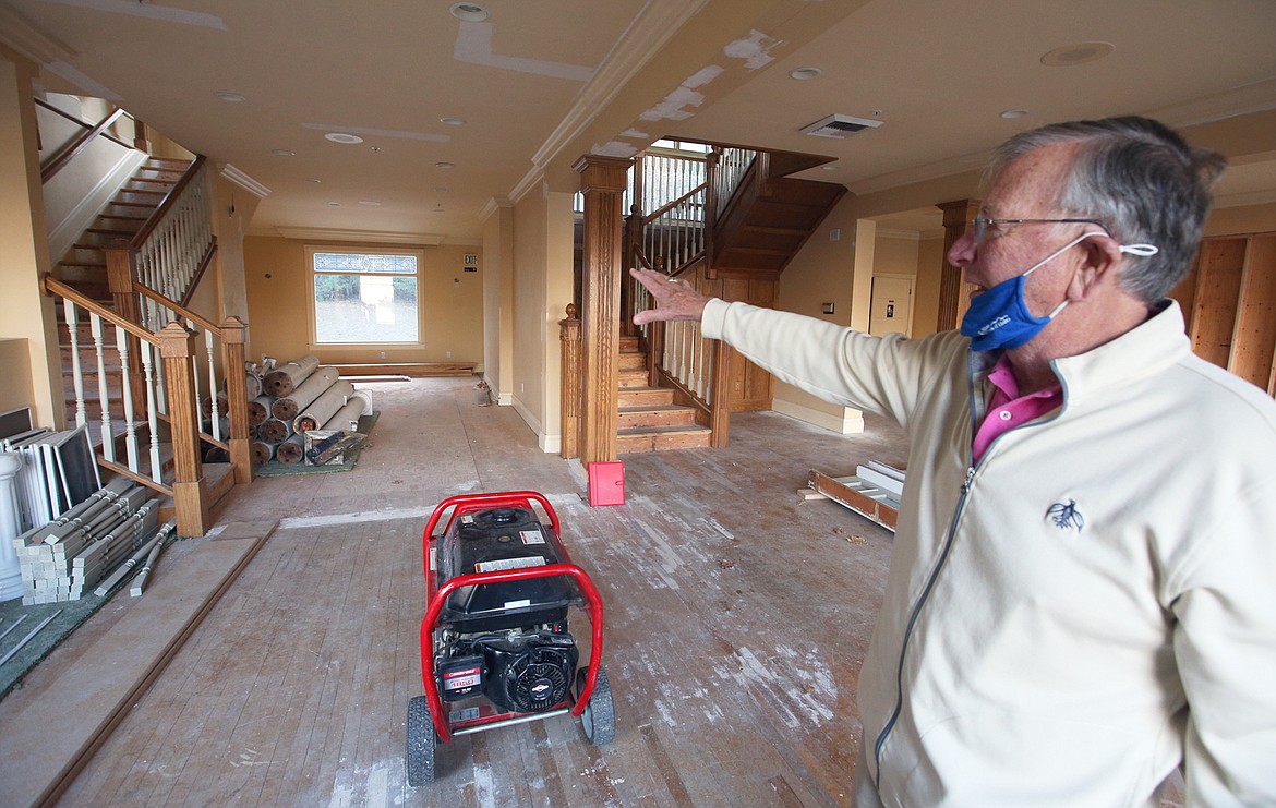 Jim Faucher, fundraising consultant, gestures toward the interior of the future home of the Museum of North Idaho following Friday's donation ceremony.