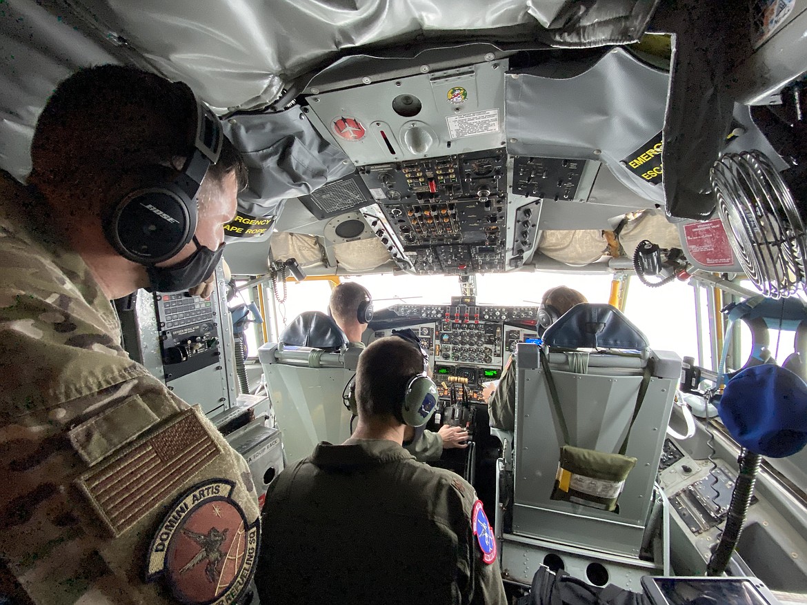 Twenty-seven thousand, five hundred feet in the sky Tuesday morning, the KC-135 Stratotanker and Fairchild Air Force Base's 93rd Air Refueling Squadron performed in-air plane refueling and pilot training exercises. From left: Senior Master Sargent Ryan Clauss, Major Luke Huebener, Major Stephen Steel, Captain Jordan Camacha. (MADISON HARDY/Press)