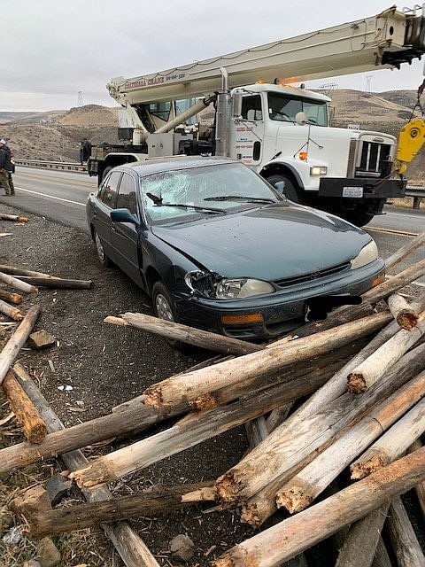 Law enforcement officers said Monday that it was "amazing" that the occupants of the '96 Toyota Camry involved in Monday's incident only sustained minor injuries, after a wooden pole careened straight through the windshield and narrowly missed the passenger.