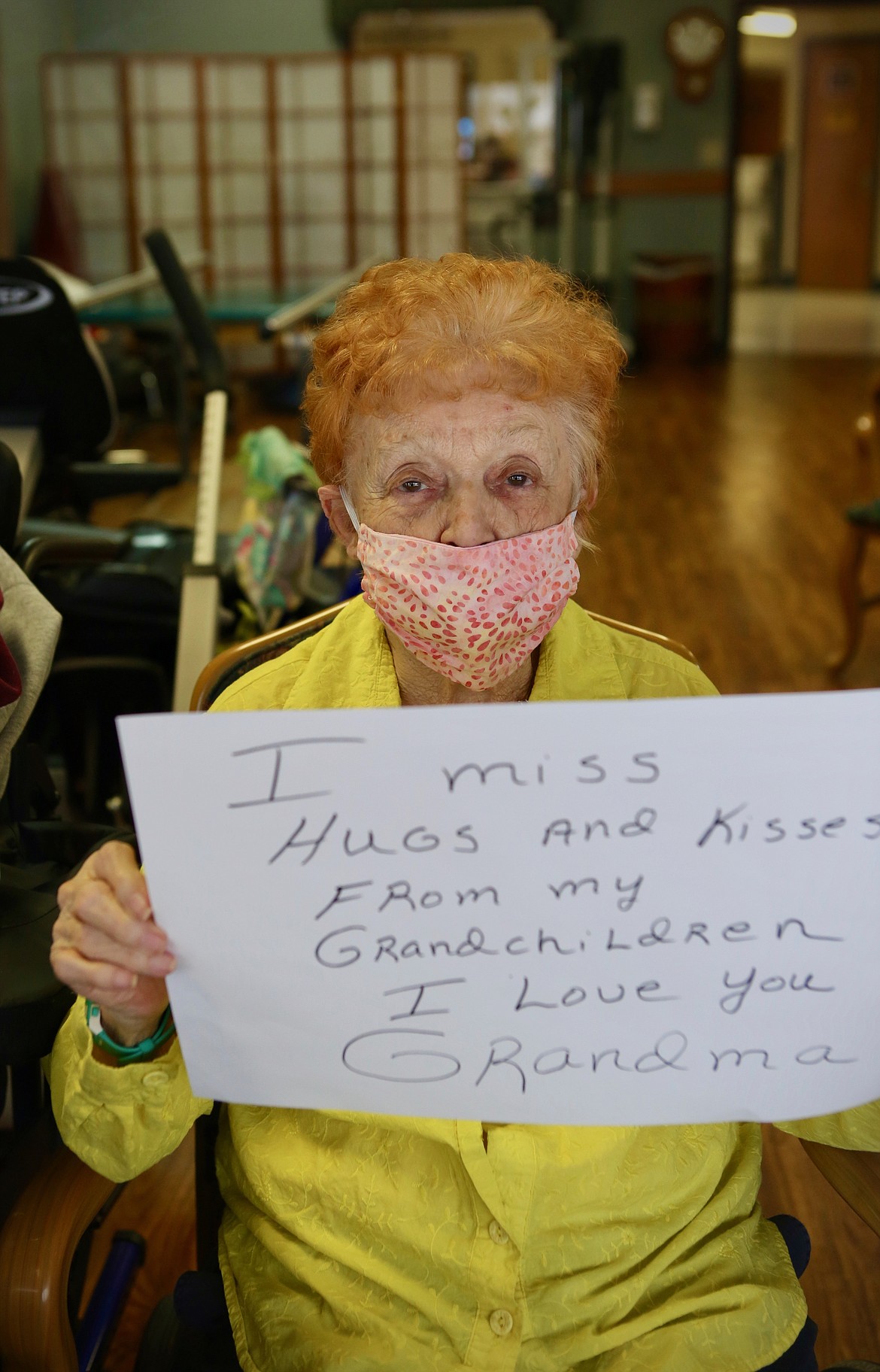 Mackenzie Reiss/Bigfork Eagle
Pat Ellwell, 85, holds up a sign for her grandchildren that said" "I miss hugs and kisses from my grandchildren. I love you. -Grandma."