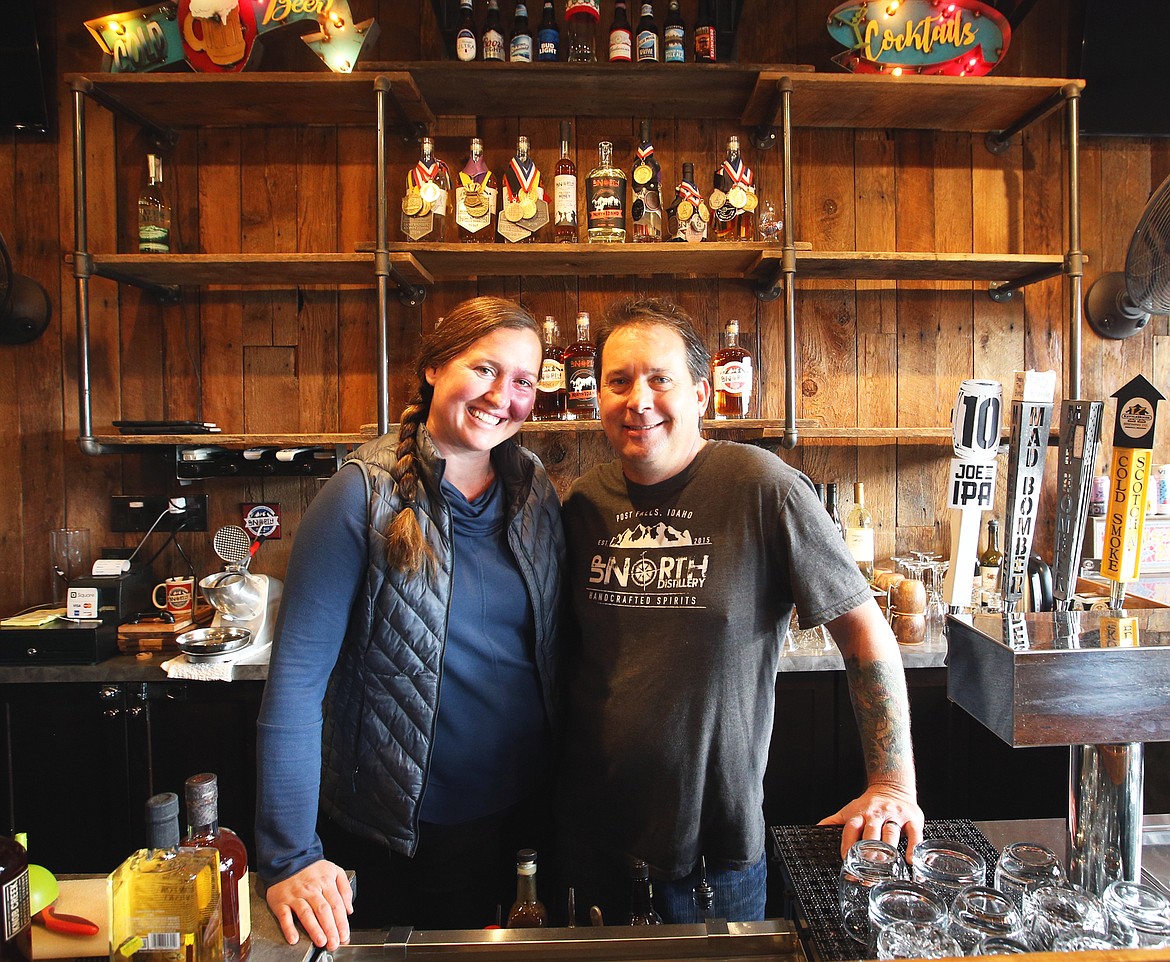 Randy and Hilary Mann behind the bar at Up North Distillery.