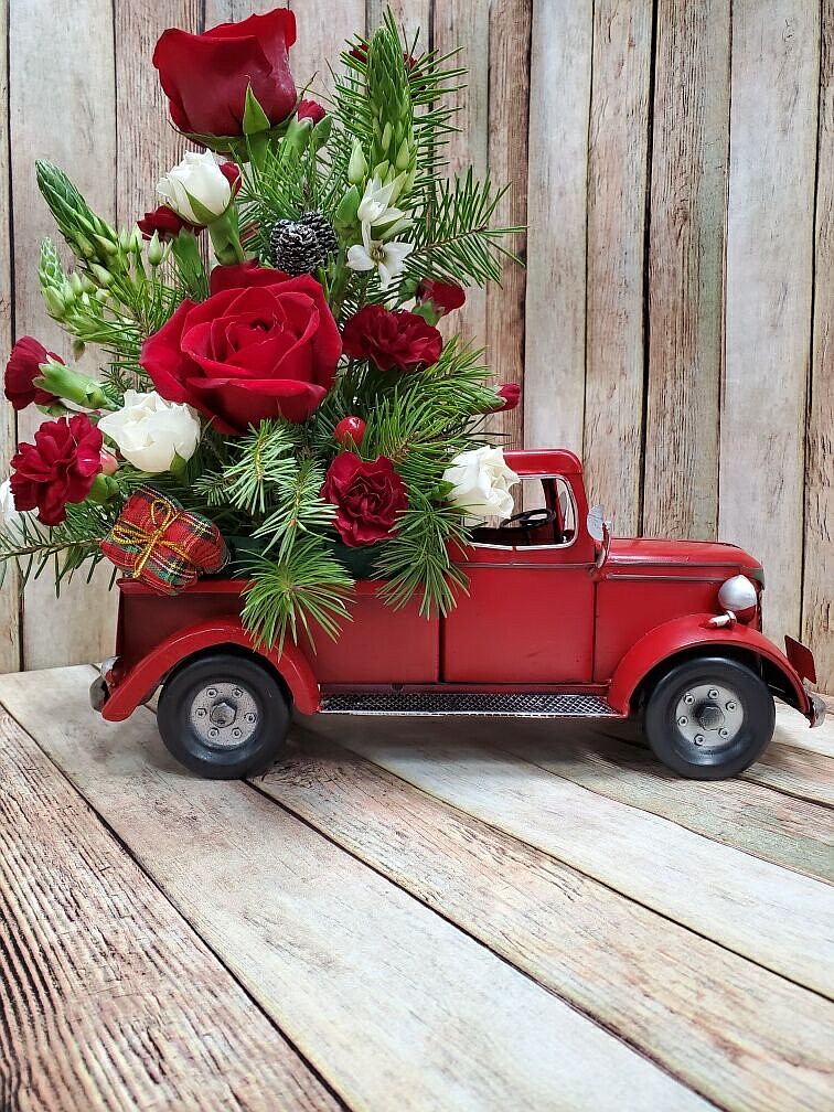 Upcoming on December 19, Shauna Herman with Creative Expressions is hosting back-to-back classes where customers will create a fresh flower arrangement identical to this red truck. Photo courtesy Shauna Herman with Creative Expressions.