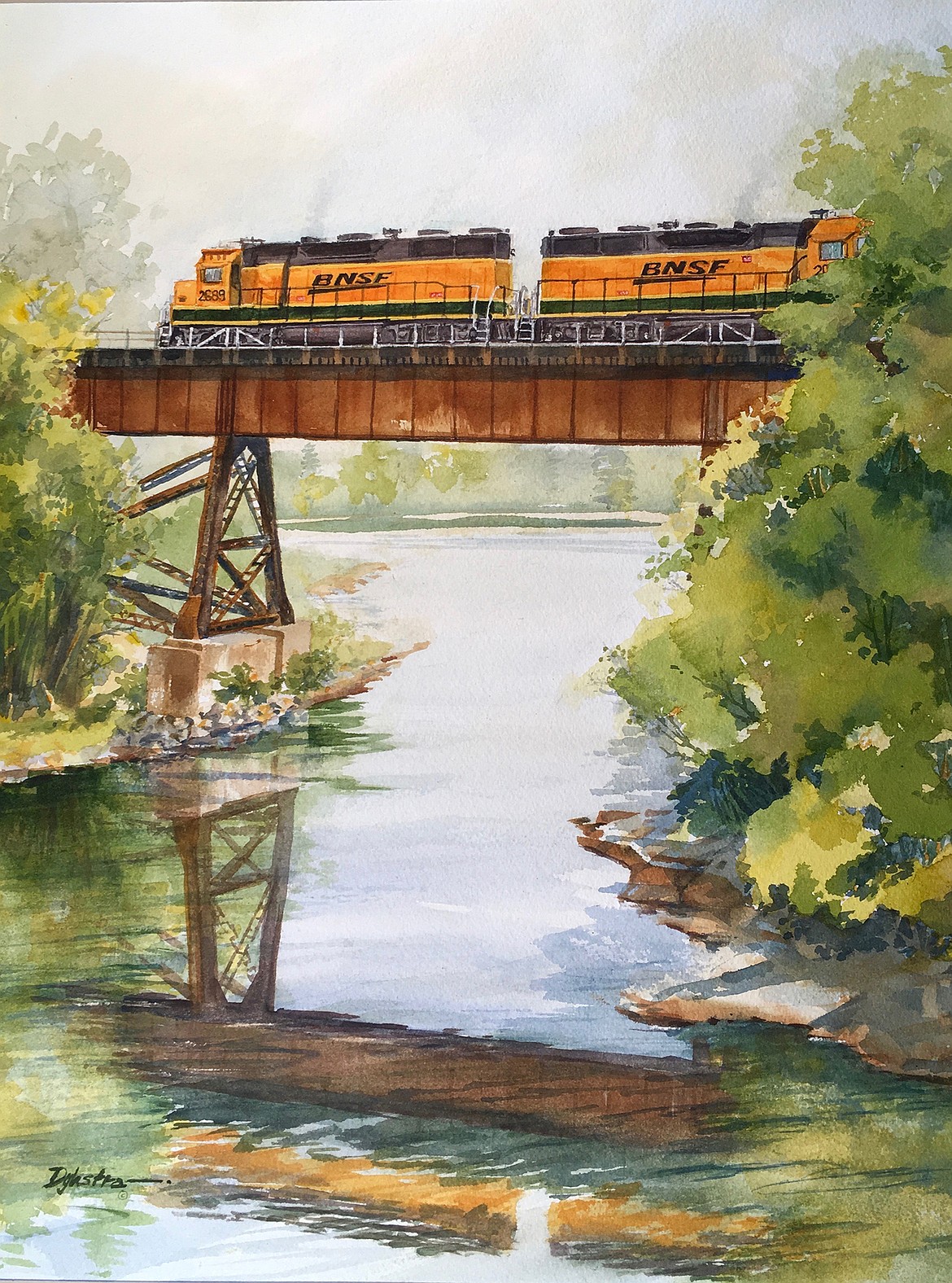 Jack Dykstra’s "Almost Home" shows a BNSF train crossing the Whitefish River to enter the Whitefish freight yard.