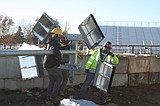 Setting up lights at fairgrounds arena is a slow, precise process