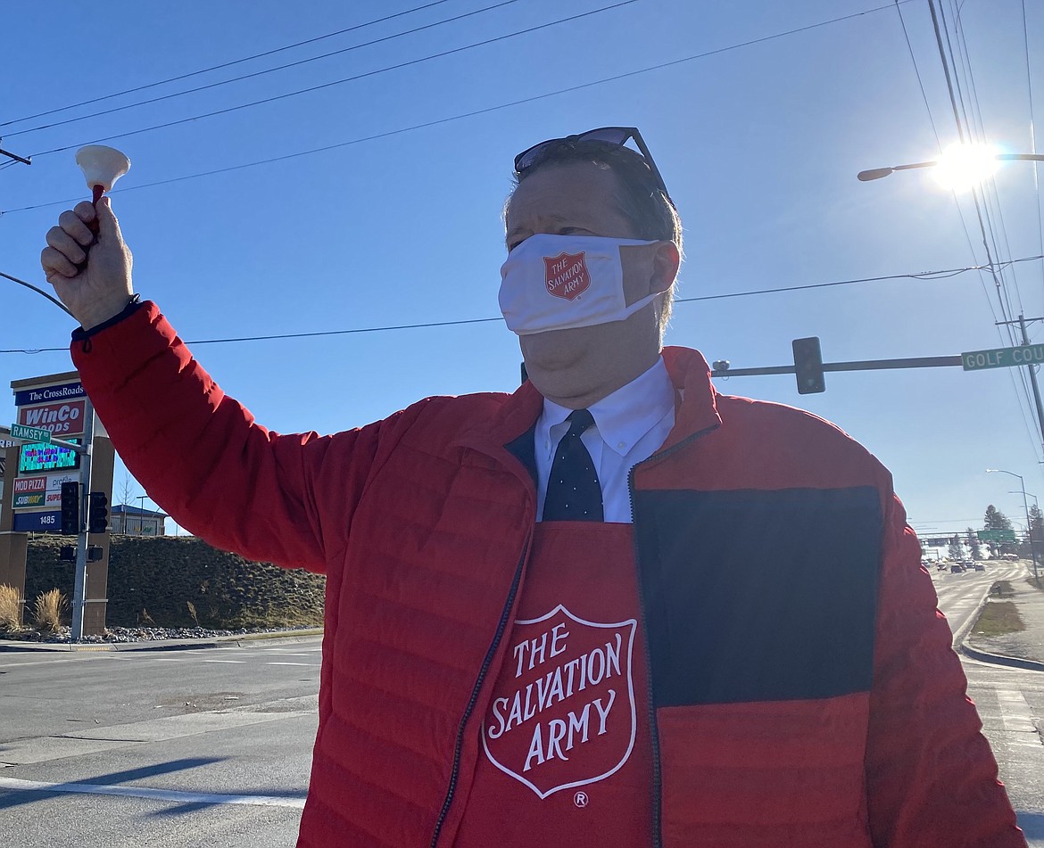 Hayden Mayor Steve Griffitts shakes his bell on Tuesday morning encouraging Kootenai County residents to participate in The Salvation Army Kroc Center's red kettle program. (MADISON HARDY/Press)