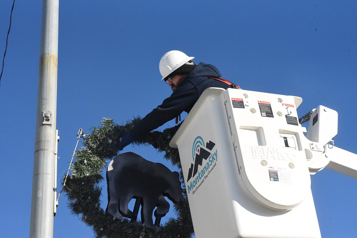 Montana Sky and Managhan's Furniture employees decorated Mineral Avenue with Christmas wreaths on Dec. 2. (Will Langhorne/The Western News).