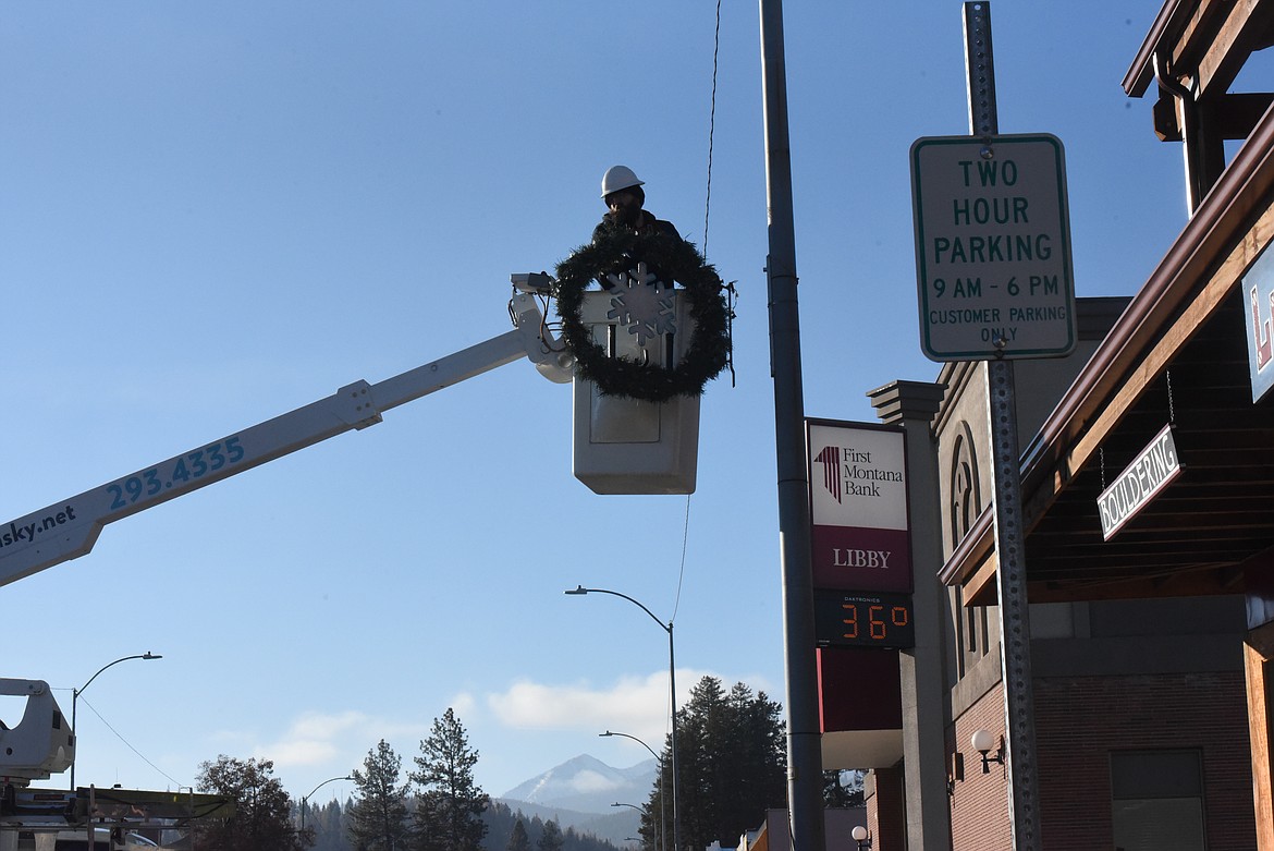 Montana Sky and Managhan's Furniture employees decorated Mineral Avenue with Christmas wreaths on Dec. 2. (Will Langhorne/The Western News).