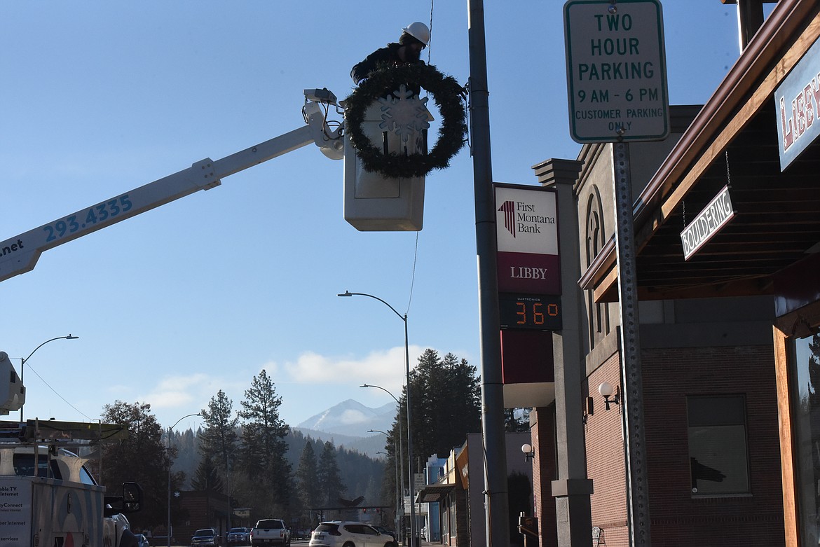 Montana Sky and Managhan's Furniture employees decorated Mineral Avenue with Christmas wreaths on Dec. 2. (Will Langhorne/The Western News).