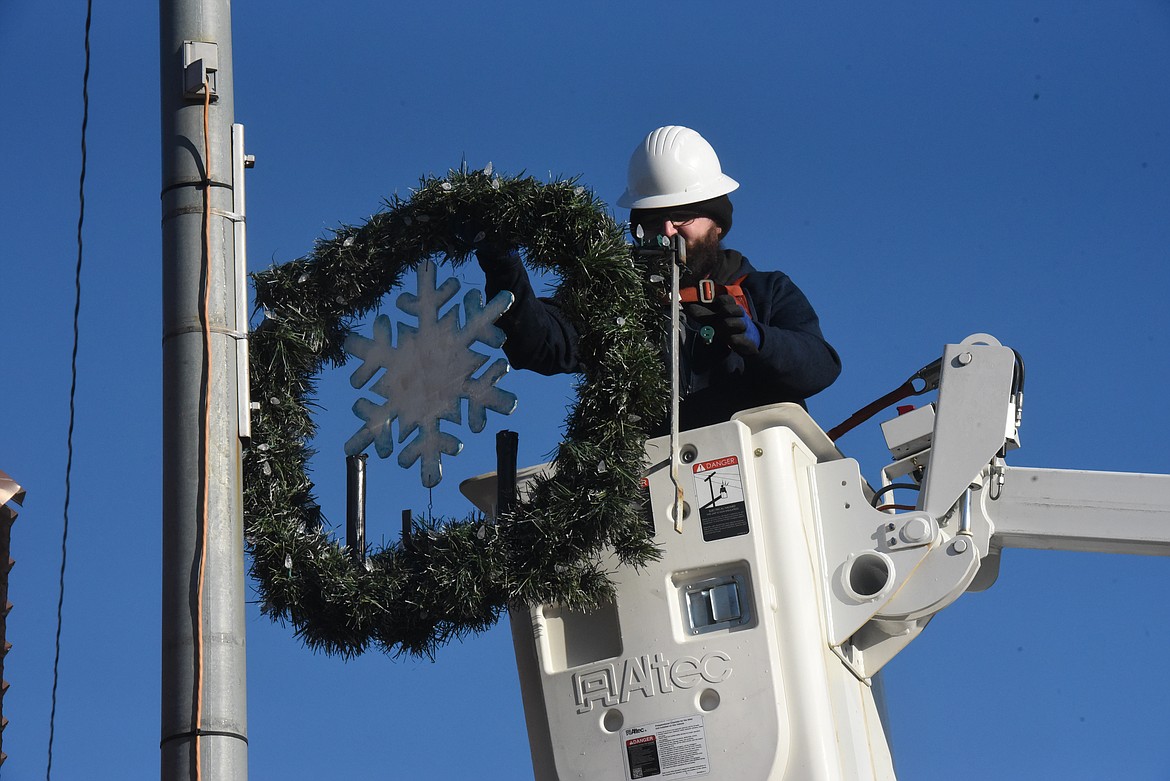 Montana Sky and Managhan's Furniture employees decorated Mineral Avenue with Christmas wreaths on Dec. 2. (Will Langhorne/The Western News).