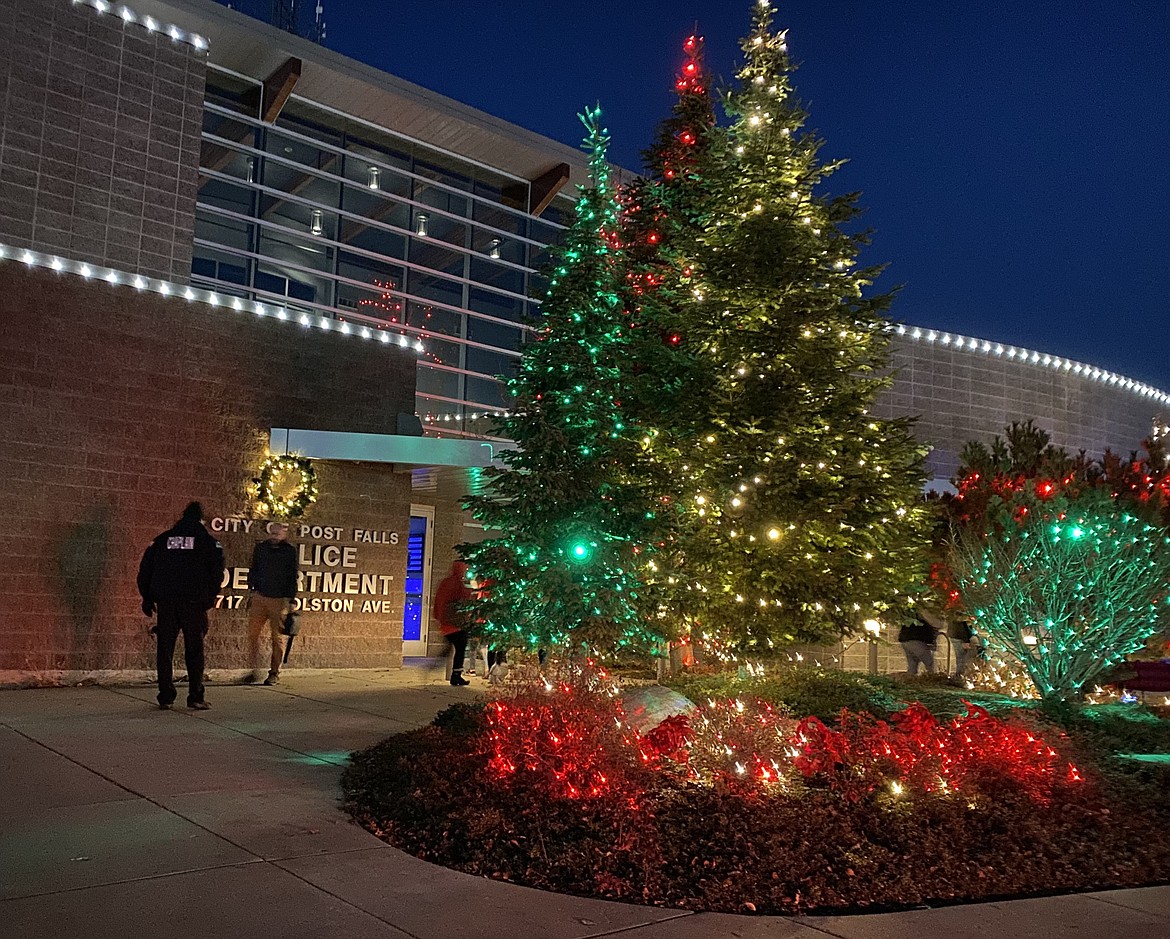 Over the years the owners of Short Green Landscaping Lisa and Shane Anderson have grown their grassroots lighting ceremony to cover over 40% of the Post Falls Police Department building. With more community involvement they hope to do more each year. (MADISON HARDY/Press)