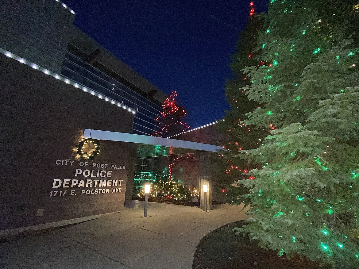 In honor of the Post Falls Police Department's service to the community, volunteers and local businesses joined Short Green landscaping in decorating the police station with dozens of multicolored Christmas lights. (MADISON HARDY/Press)