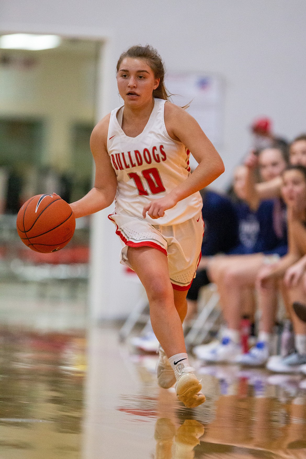 Junior Destiny Lyons dribbles the ball up the court on Thursday.