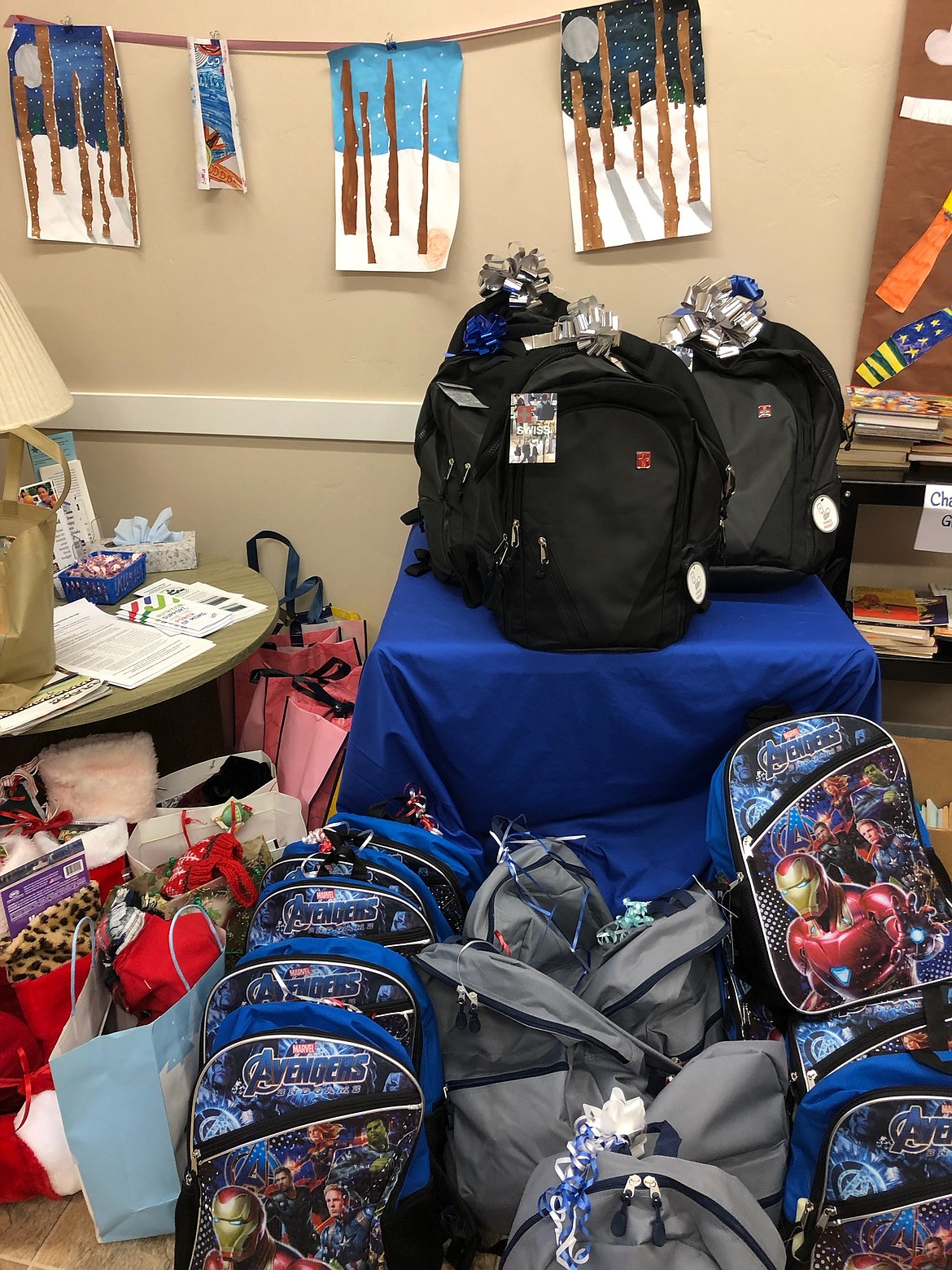 Backpacks loaded with goodies are pictured last holiday season. While Debbie Ingram's project was originally to stuff Christmas stockings, she received so many donations that she was able to fill backpacks for local children, too. 
Courtesy Debbie Ingram