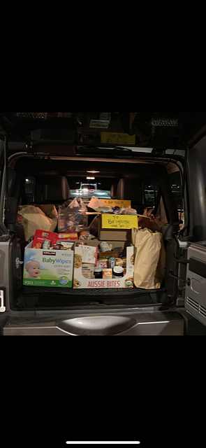 Big Bend Community College volleyball players Ellie Rodgers (Left) and Maelyn Mace drop off a donation for the Moses Lake Food Bank at the Central Park Apartments office.