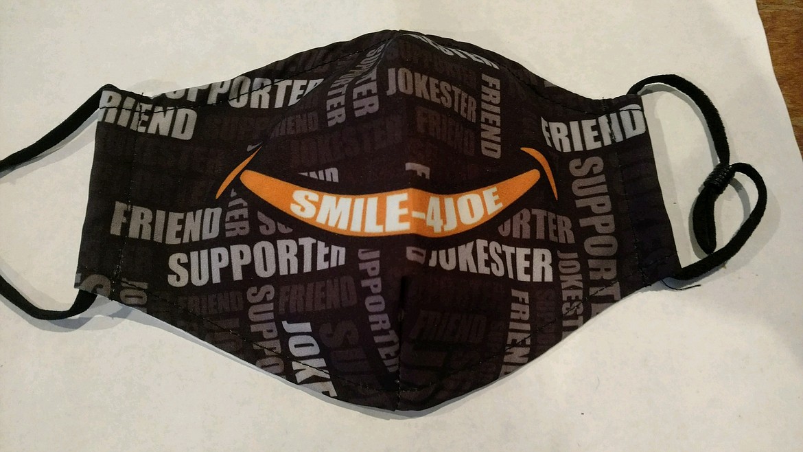 700 of these masks will go out into the community Dec. 12 during the Smile-4Joe drive-through mask giveaway at Post Falls High School in honor of Joe Hodl, longtime Post Falls resident and beloved friend, dad, grandfather and husband who died from COVID in August.