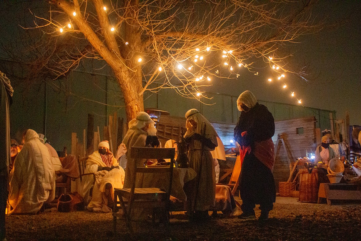 Youth group members and volunteers from the Faith Community Church in Quincy bring the town of Bethlehem to life at the Living Nativity event on Saturday night in Quincy.