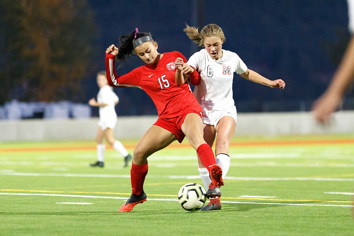 Senior Jordie Breeden fights a Moscow player for possession of the ball during the district championship on Oct. 15 at War Memorial Field. Breeden grabbed a spot on the 4A girls soccer all-state team for a second time.