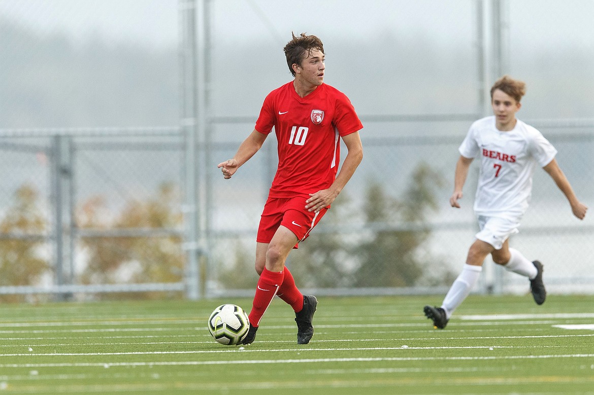 Senior Zander Moore looks for an open teammate during a match against Moscow on Oct. 8 at War Memorial Field. Moore earned a spot on the 4A boys soccer all-state team.