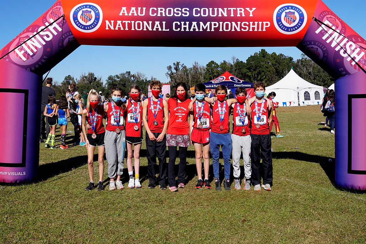 Courtesy photo
Eight members of the North Idaho Cross Country team earned medals for placing in the top 25 of their age group at the AAU National Cross Country Championships on Dec. 5 in Tallahassee, Fla. From left are Adalyn Depew, Zara Munyer, Helen Oyler, Max Cervi-Skinner, coach Erin Lydon Hart, Wyatt Carr, Mitchell Rietze, Parker Sterling and Zack Cervi-Skinner.