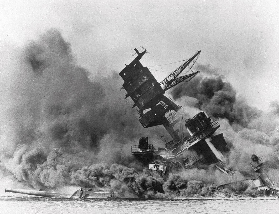 In this Dec. 7, 1941, photo, smoke rises from the battleship USS Arizona as it sinks during a Japanese surprise attack on Pearl Harbor, Hawaii. (AP Photo, File)