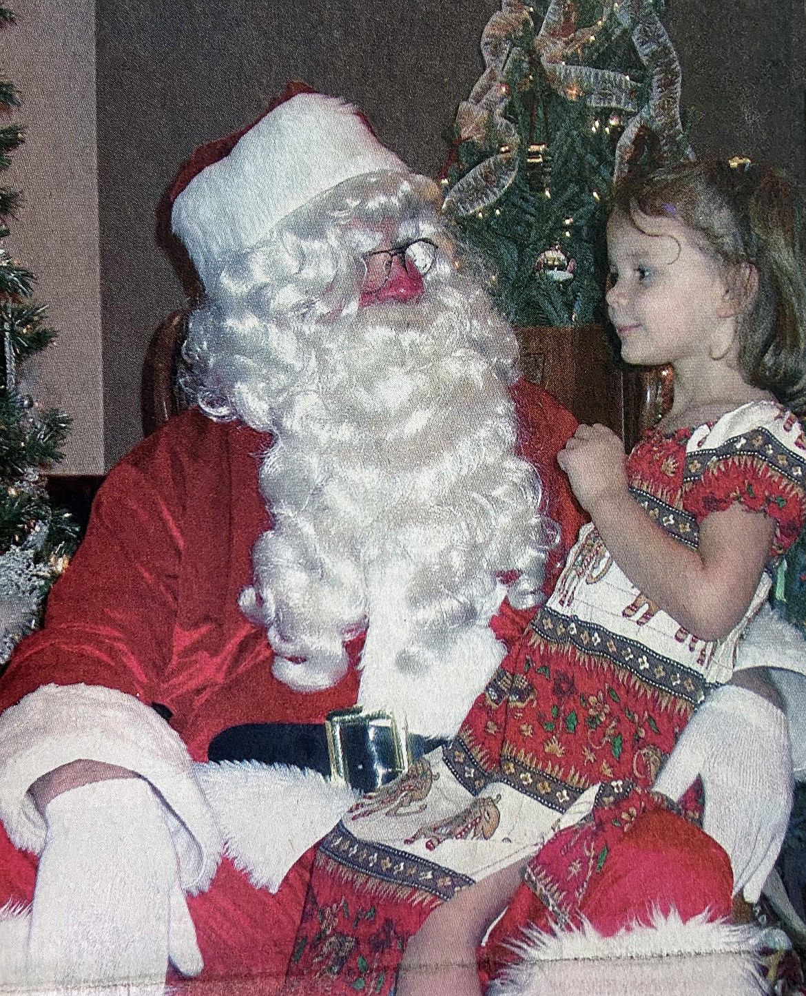 Caroline Hawkins is pictured in the December 2003 Daily Bee photo when she was first in line to visit Santa Claus as he helped kick off the Festival of Trees. Santa arrived to a hearty welcome to the event which benefits Kinderhaven, which offers temporary foster care to children.