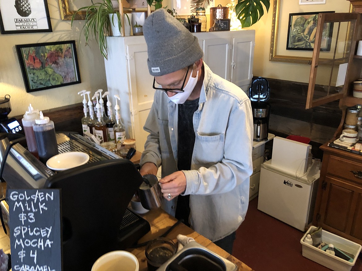 Blayne Walsh of Cloudview Kitchen foams milk for a mocha.
