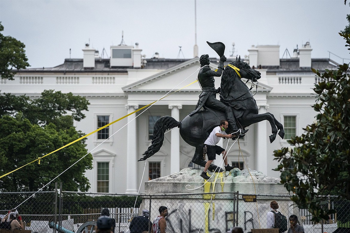 Protesters attempt to tear down an Andrew Jackson statue at Lafayette Square in front of the White House on June 22, 2020.