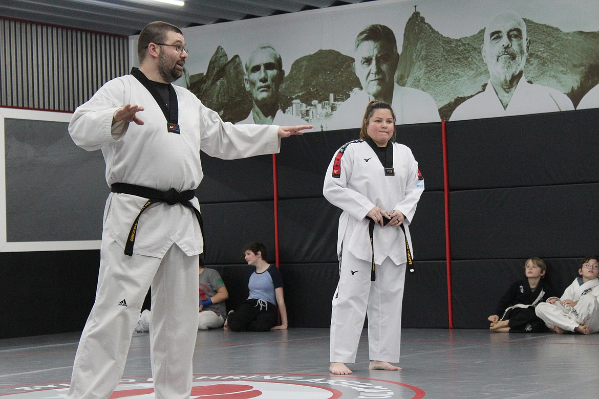 (Photo by Victor Corral Martinez)
Coaches Anderson and Arcinas speaking to the students testing for belts.