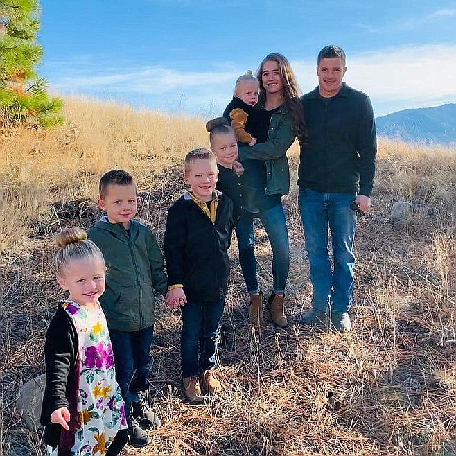 The McMahons are pictured in a recent family portrait near their home in Dayton. The home and garage were lost in a fire Monday afternoon. (Courtesy photo)