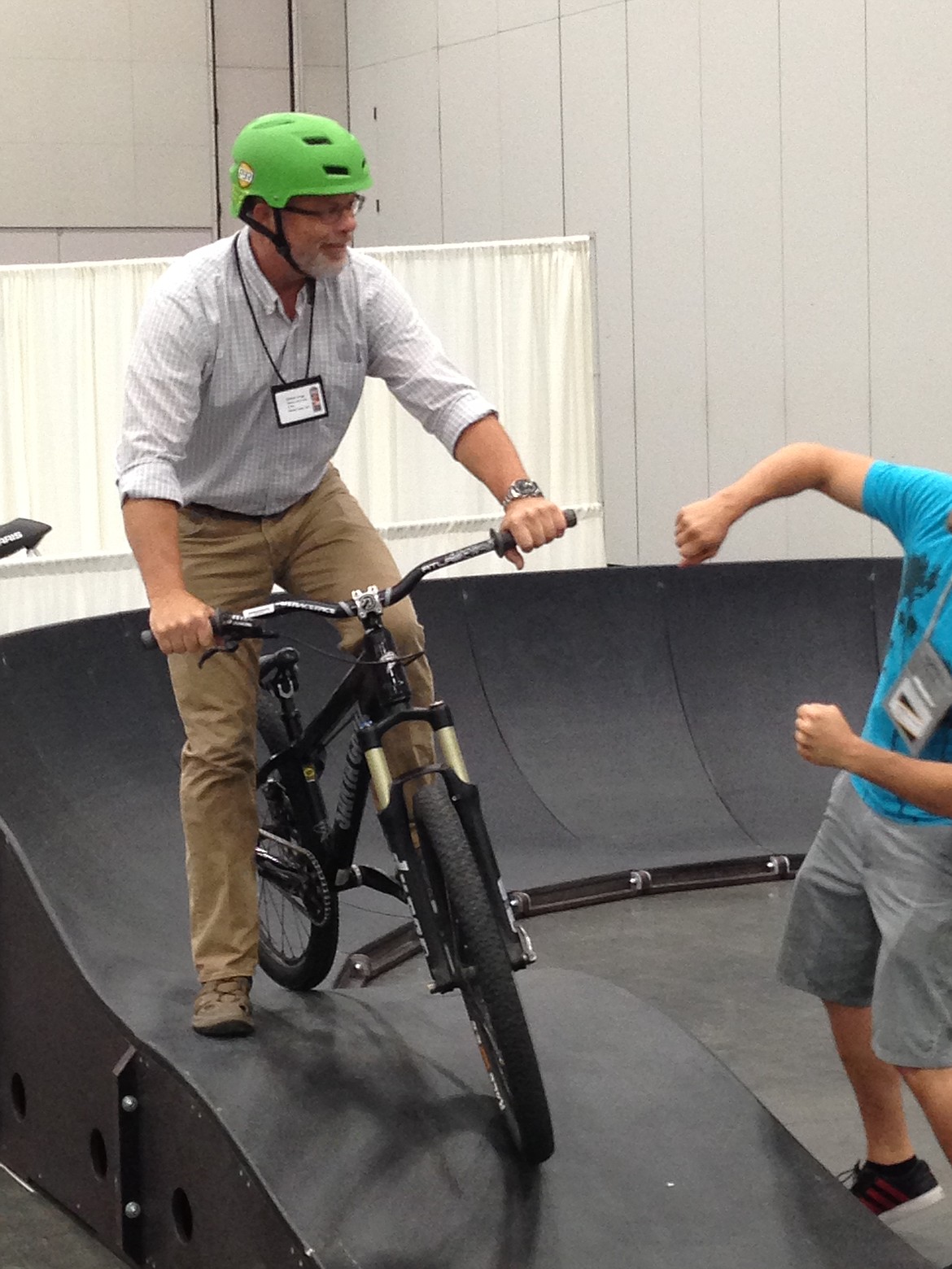 At a 2014 Trails Symposium Trade Show demonstration in Portland, Oregon, Grigg is seen playing around on a pump track.