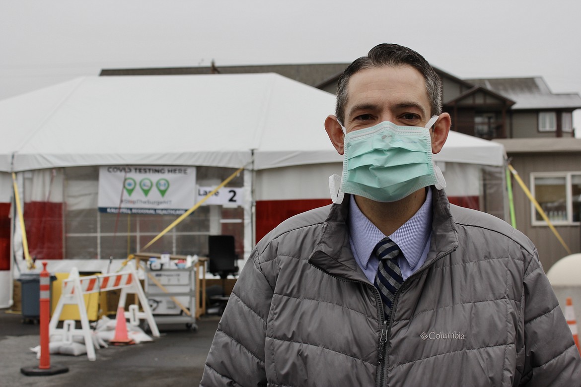 Dr. Adam Smith stands in front of a COVID-19 screening tent in Kalispell on Dec. 4. Smith is the medical director of primary care for Kalispell Regional Healthcare and is a member of the Physician Network leadership team. (Kianna Gardner/Daily Inter Lake)