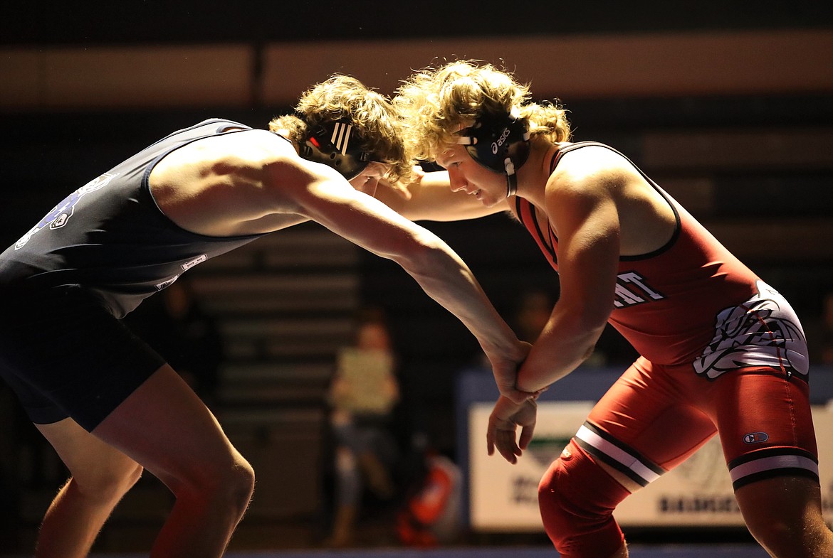 Junior Blake Sherrill faces off with Eli Richards from Bonners Ferry on Thursday.