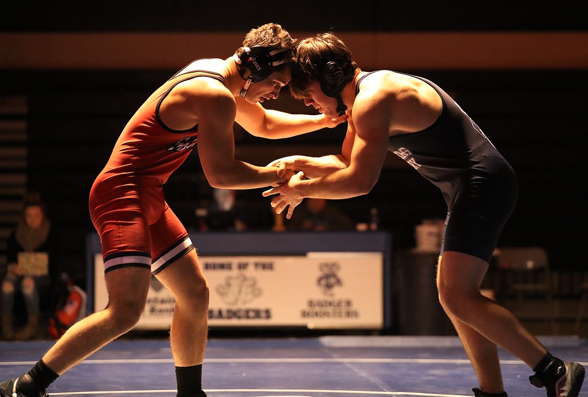 Senior Isaac Webb (left) goes head-to-head with Bonners Ferry's Nathaniel Varelman on Thursday.