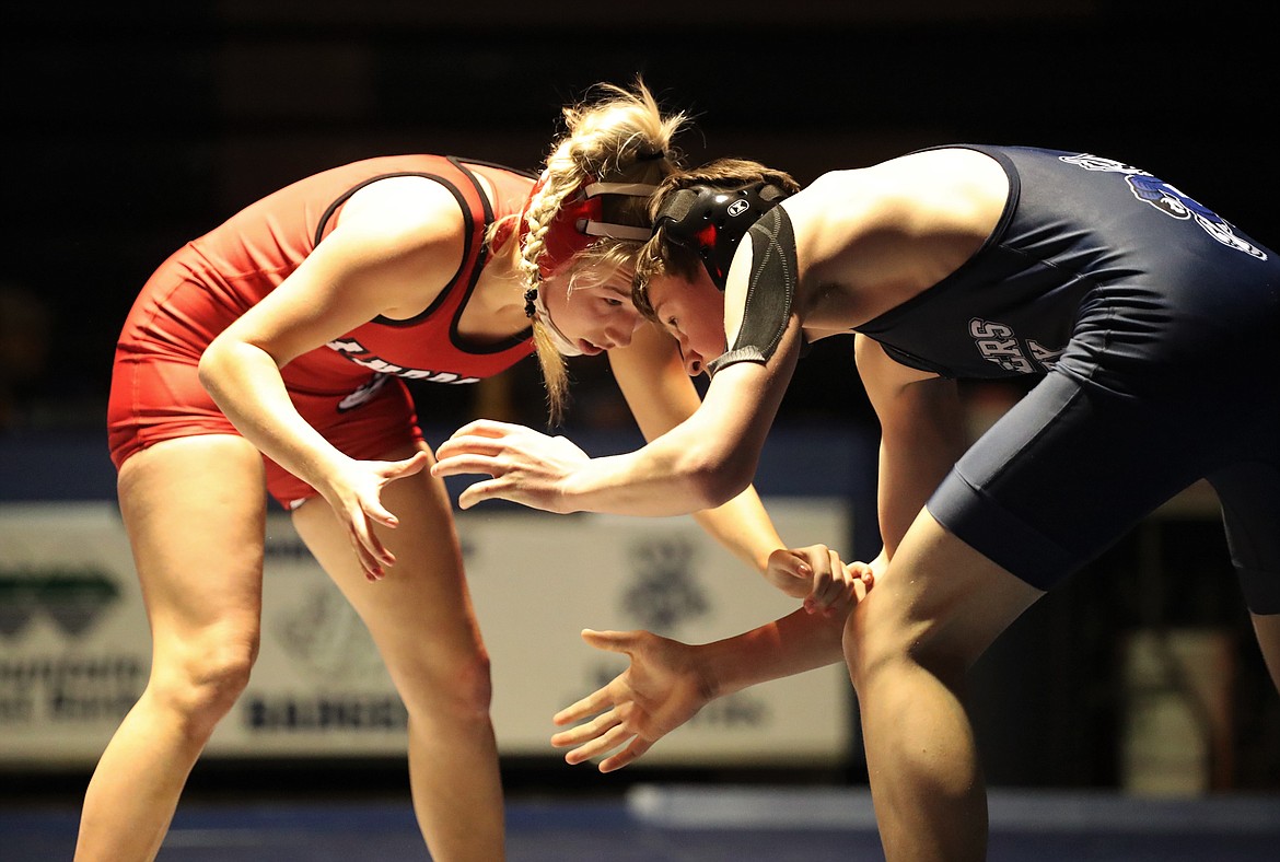 Senior Kayelin Johansen (left) hand fights with Dillon McLeish from Bonners Ferry in a 126-pound match Thursday night.