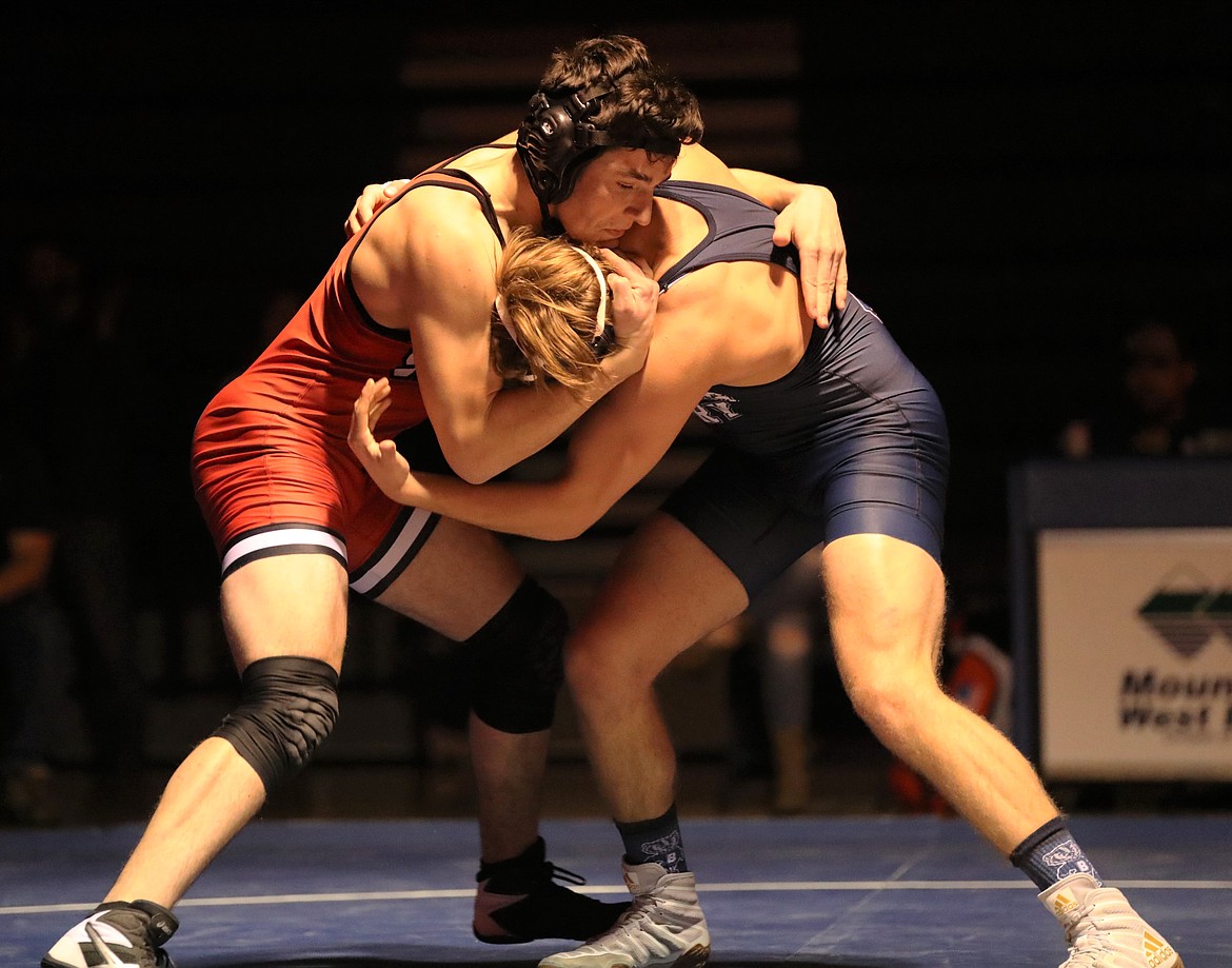 Sandpoint's Sam Becker (left) attempts to takedown Bryan Durette during a 160-pound bout on Thursday.