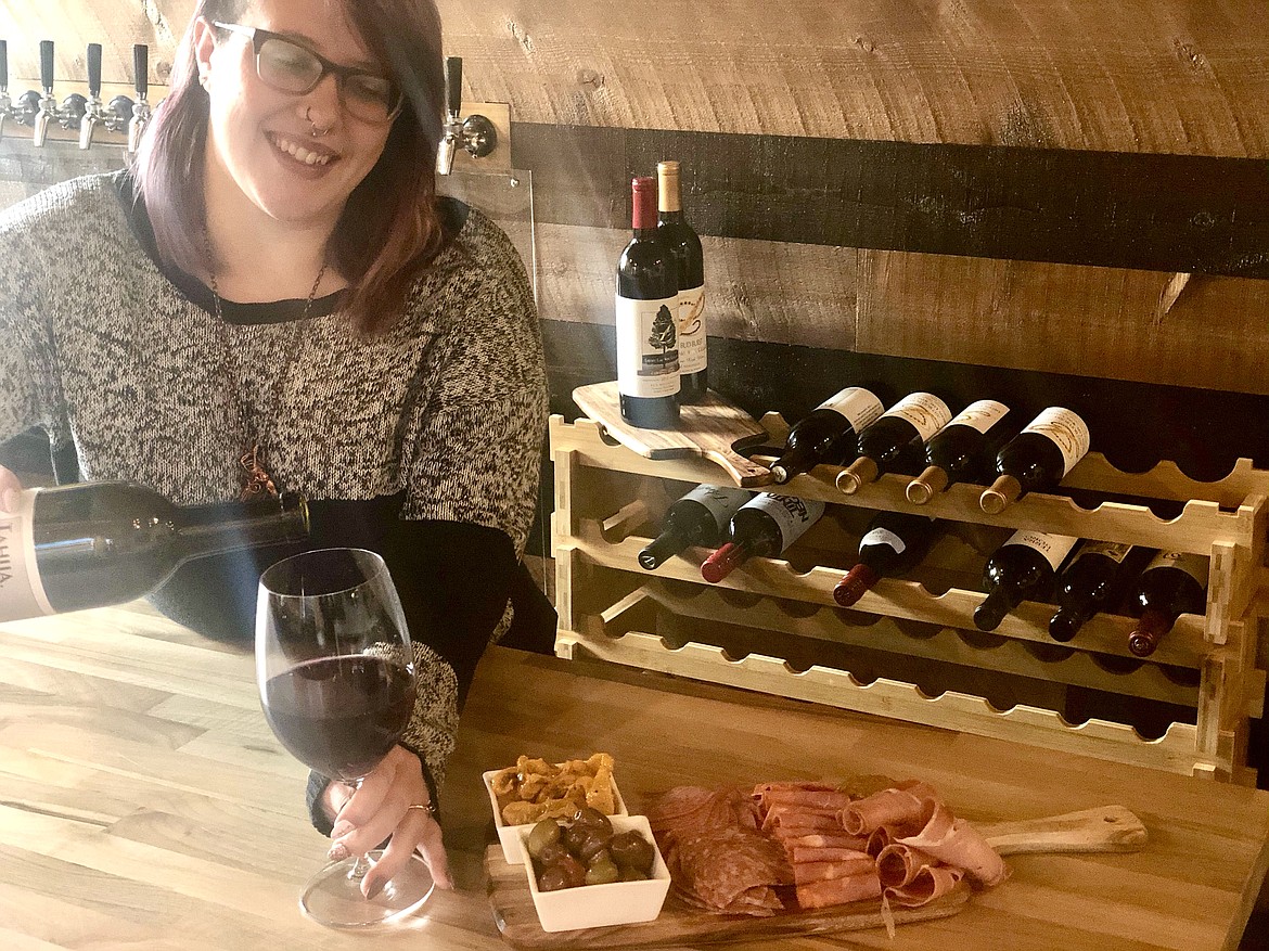 Courtesy photo
Manager Jade Crosier pours a glass of wine at the CK Barrel Room, which is open behind the Collective Kitchen at 501 Sherman Ave.