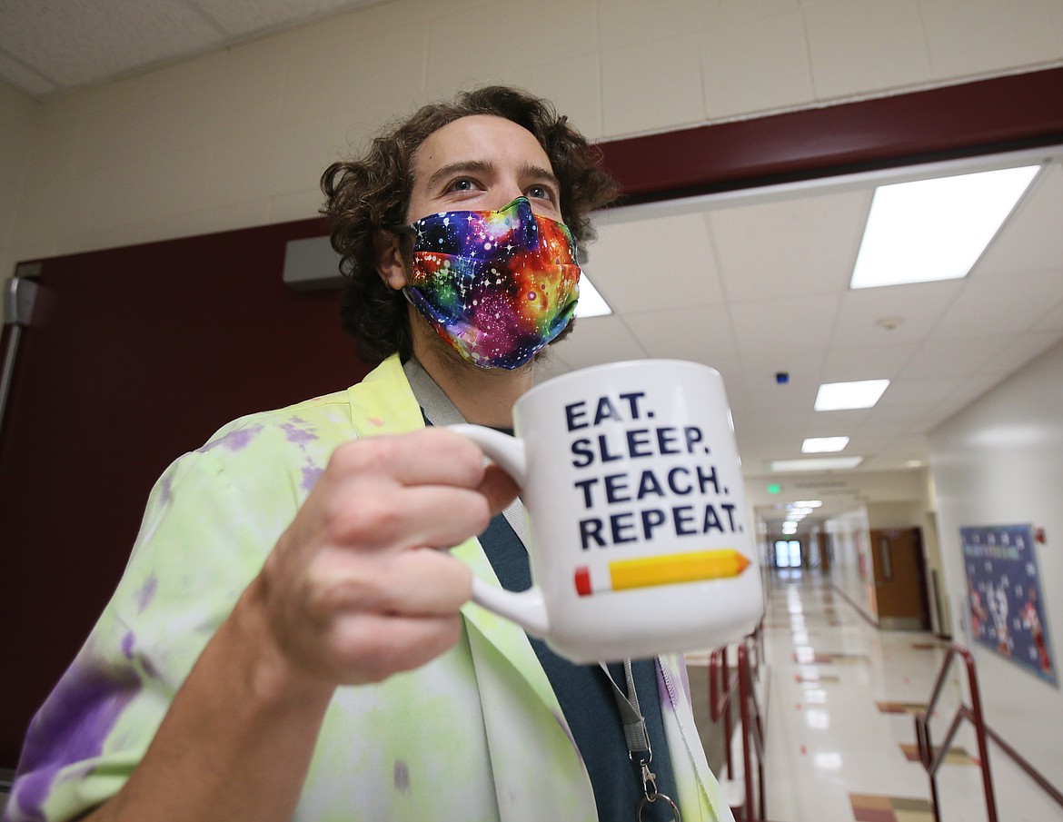 "Eat. Sleep. Teach. Repeat." Ramsey fourth grade teacher Steve Blee's mug summarizes what many educators are feeling as they navigate long days and lots of work through the COVID-19 pandemic. Blee is seen here on the way to his classroom Friday.