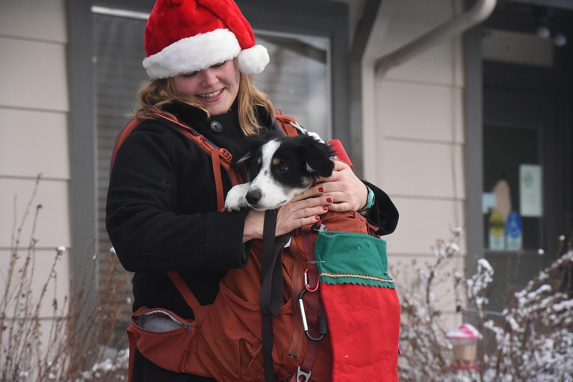 Jamilee Scheiwe and her dogs Strkyer, pictured, and Montana toured the Libby Care Center on Dec. 12. Since October, Scheiwe has organized multiple outings to the nursing home facility to boost the morale of residents and staff. (Will Langhorne/The Western News).