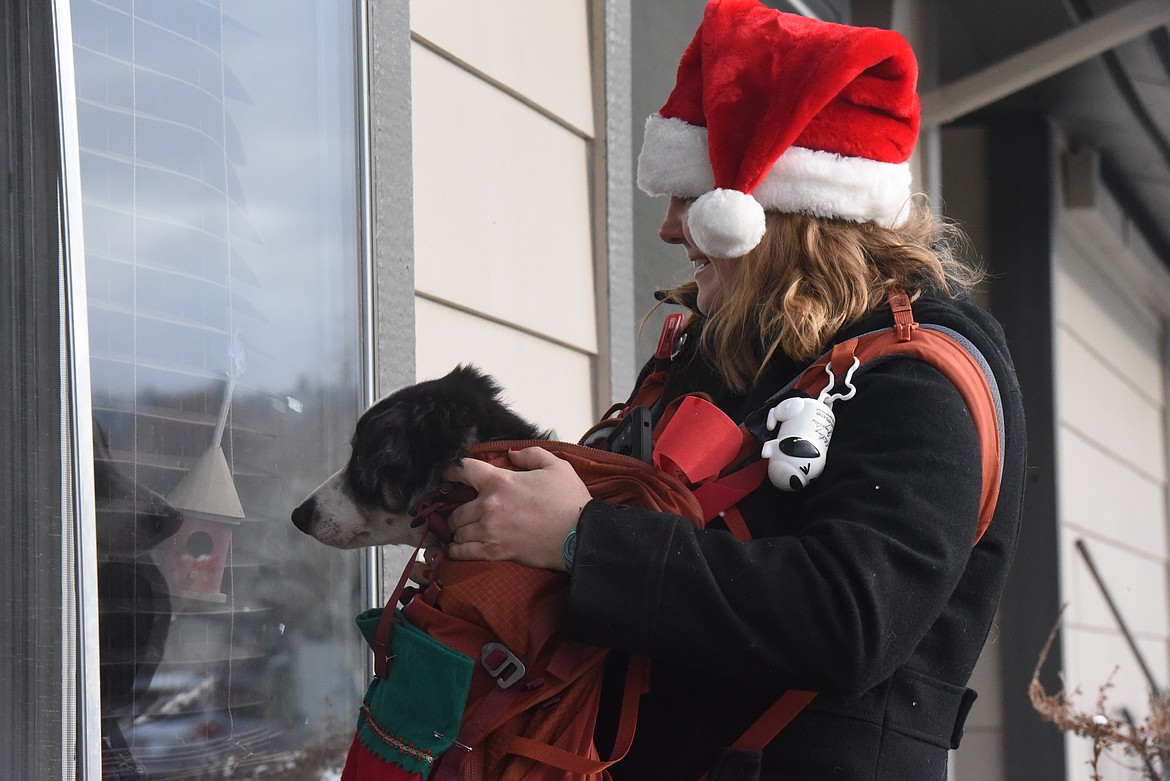 Jamilee Scheiwe and her dogs Strkyer, pictured, and Montana toured the Libby Care Center on Dec. 12. Since October, Scheiwe has organized multiple outings to the nursing home facility to boost the morale of residents and staff. (Will Langhorne/The Western News).