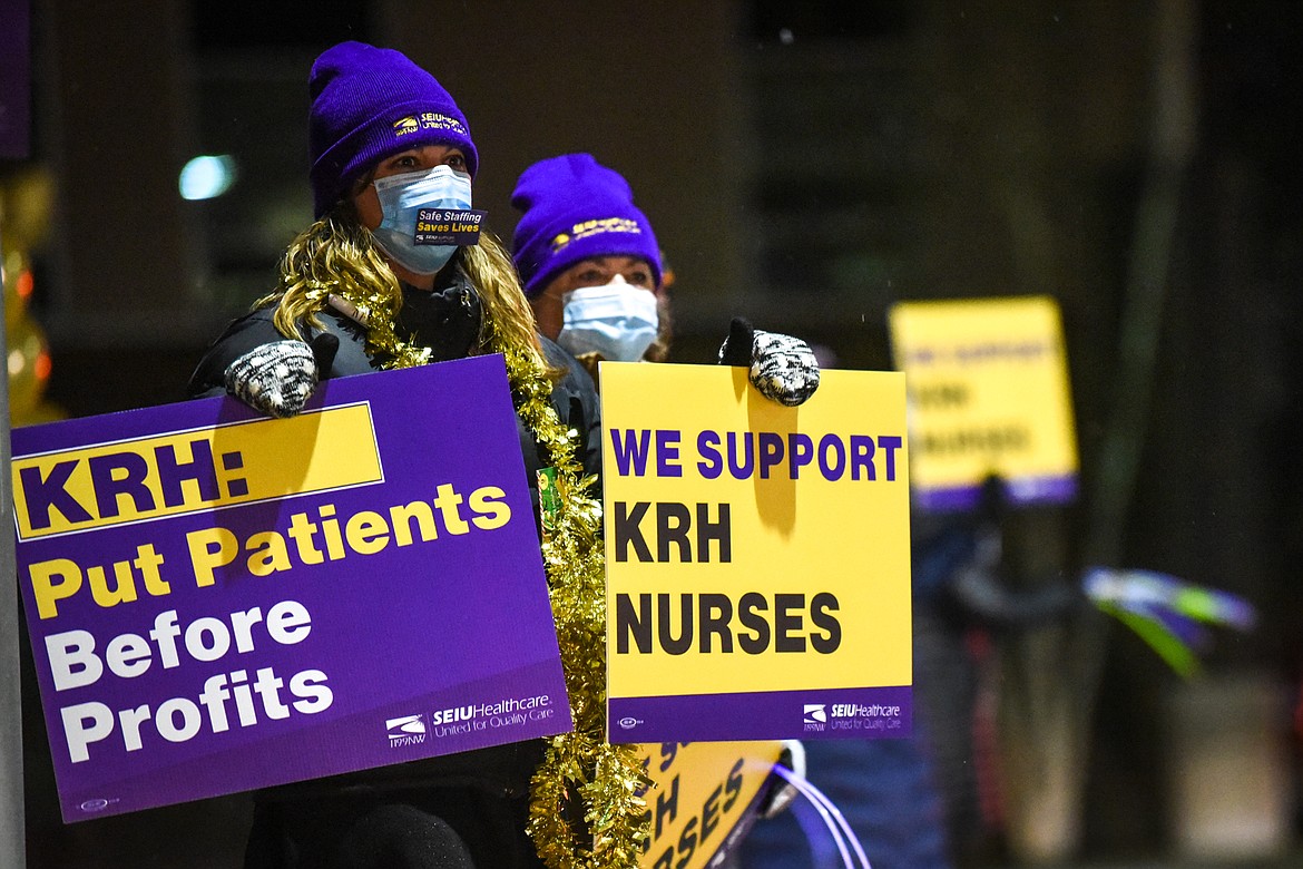 Logan Health registered nurses hold signs during a "Solidarity Drive" car caravan for a fair contract outside Kalispell Regional Medical Center on Friday, Dec. 11, 2020. (Casey Kreider/Daily Inter Lake)