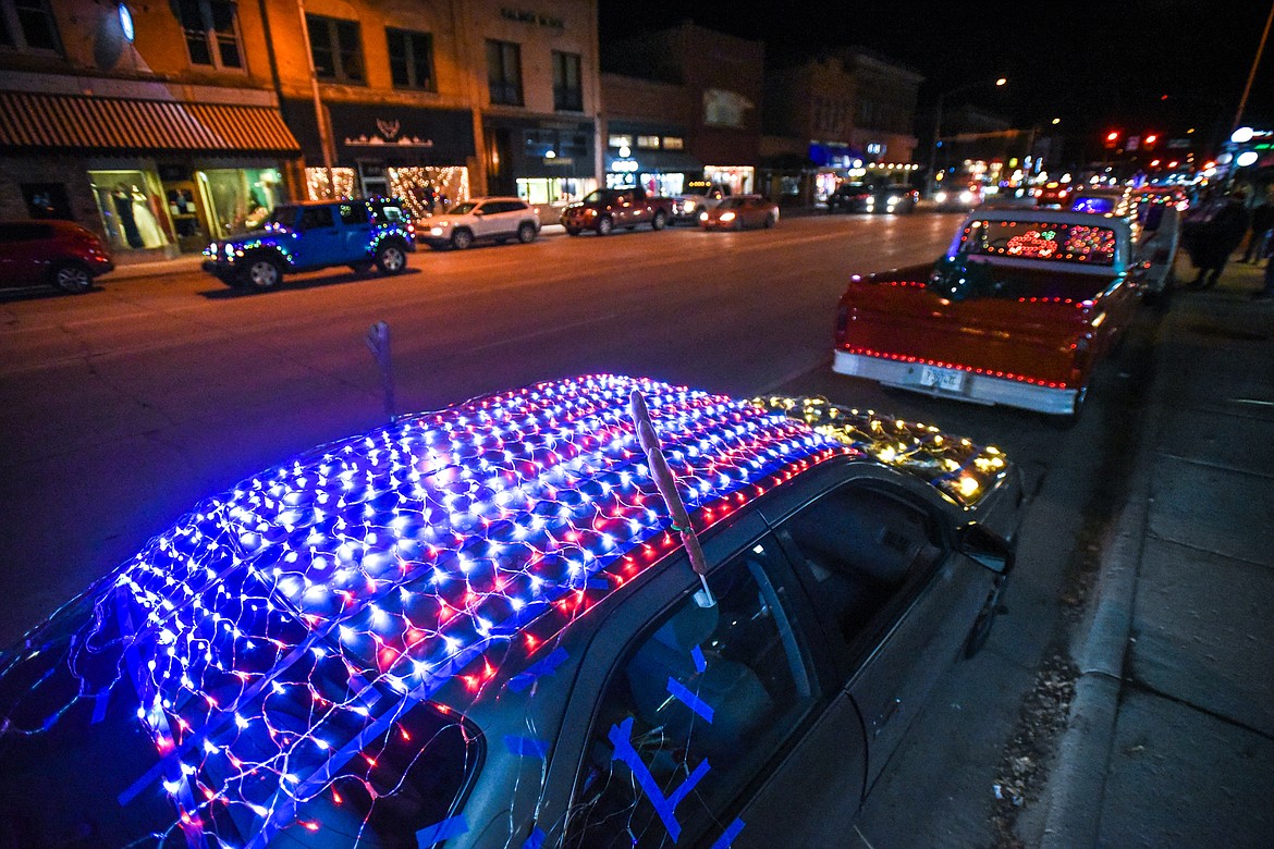 Christmas lights in the design of an American flag decorate a car at the Elevation Christmas Light Car Show in downtown Kalispell on Saturday, Dec. 12. (Casey Kreider/Daily Inter Lake)