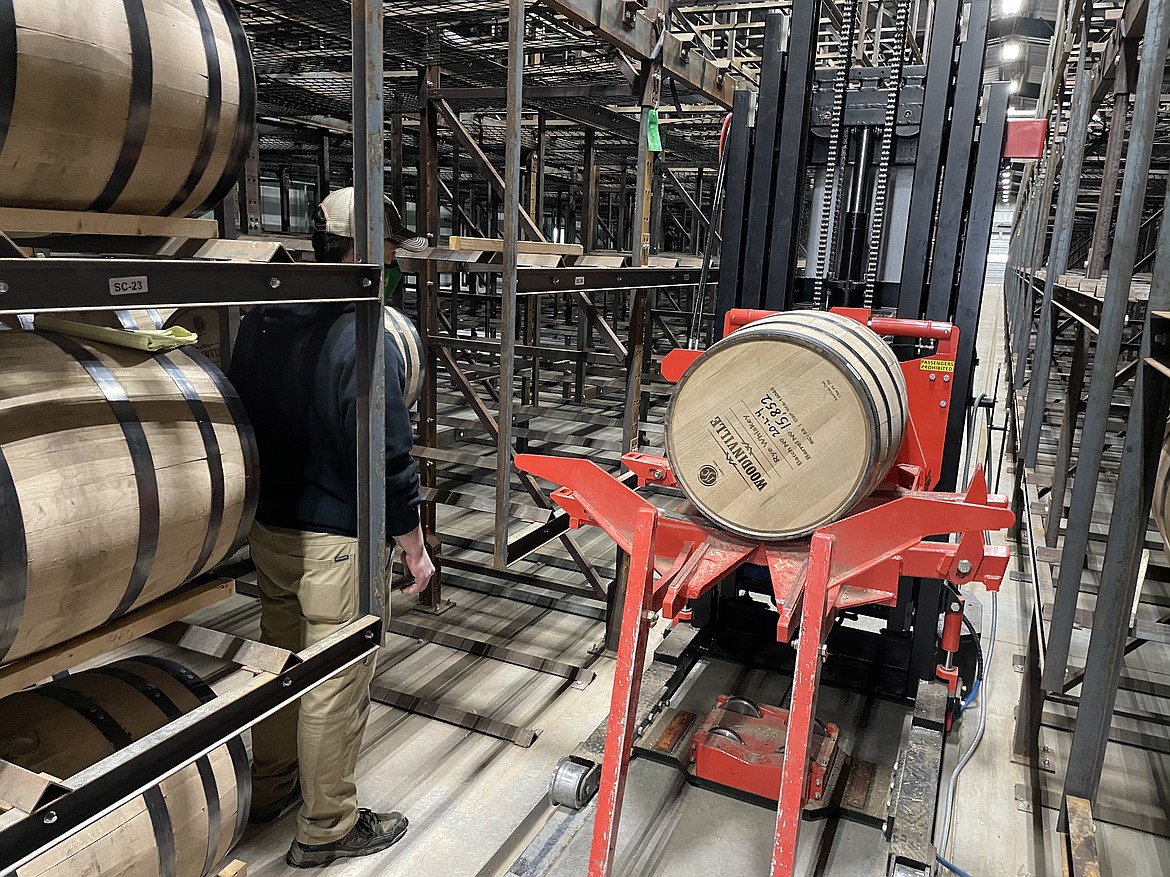 Elijah Gregg racking barrels at one of Woodinville Whiskey Co.'s Quincy warehouses.