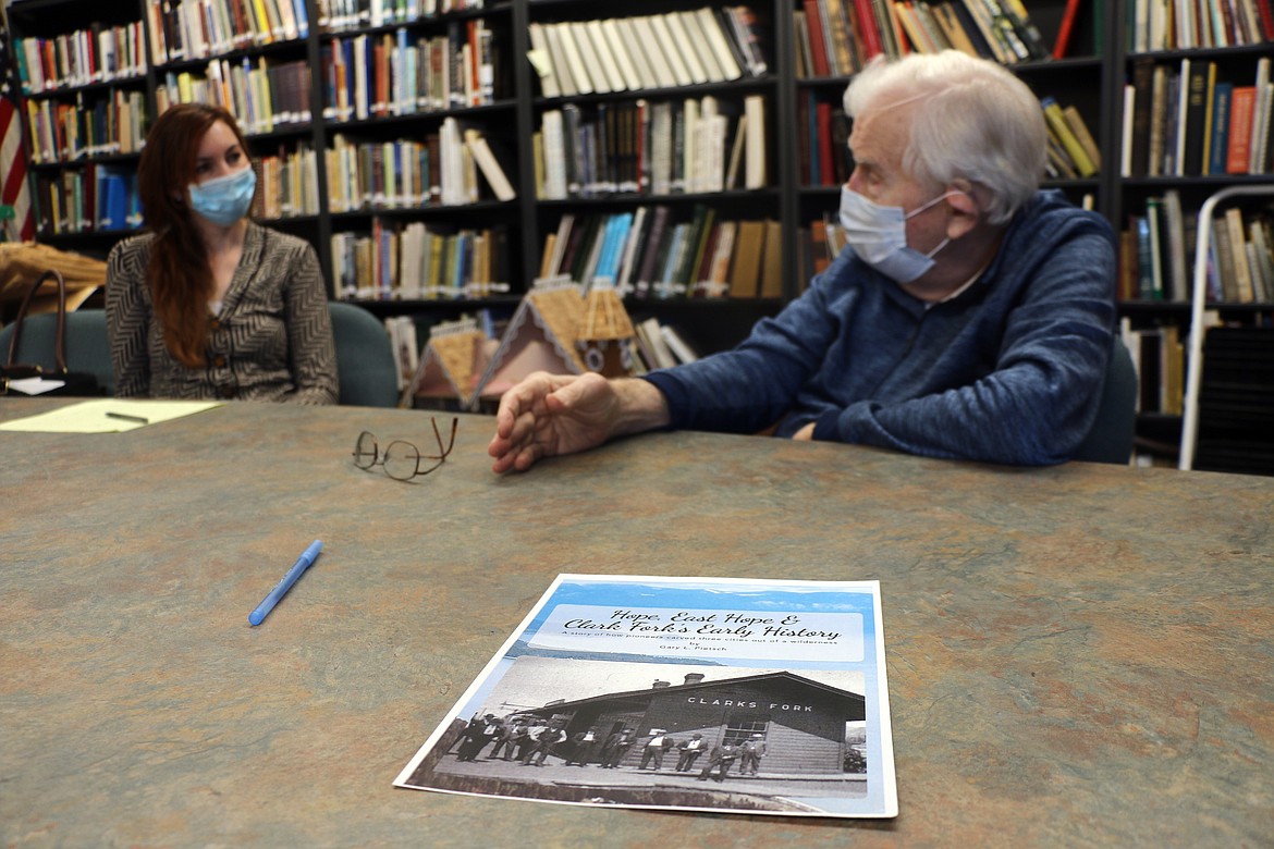 Heather Upton, Bonner County History Museum executive director, listens as local author and historian Gary Pietsch talks about his new book, "Hope, East Hope & Clark Fork's Early History". All proceeds from the sale of the book are being donated to the museum.
