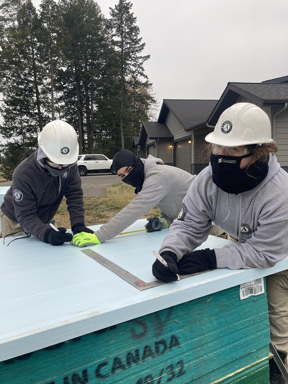 Americorps volunteers working on construction for a housing project with Habitat for Humanity in Lakeside.