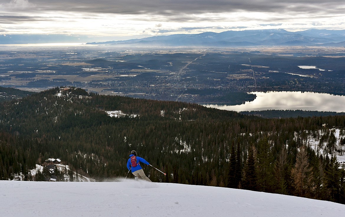 A skier carves down the Toni Matt trail on Whitefish Mountain Resort's opening day of the 2020-21 season Thursday, Dec. 10. (Whitney England/Whitefish Pilot)