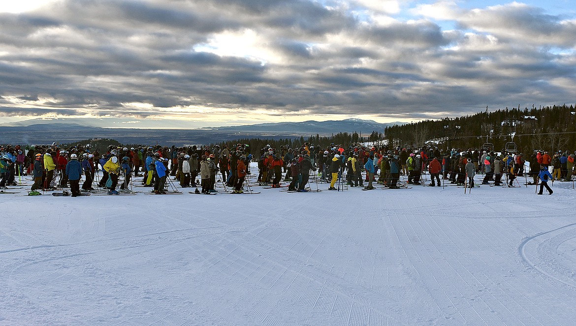 The lift line at Whitefish Mountain Resort's Chair 1 was becoming longer by the minute the morning of Opening Day on Thursday. (Whitney England/Whitefish Pilot)