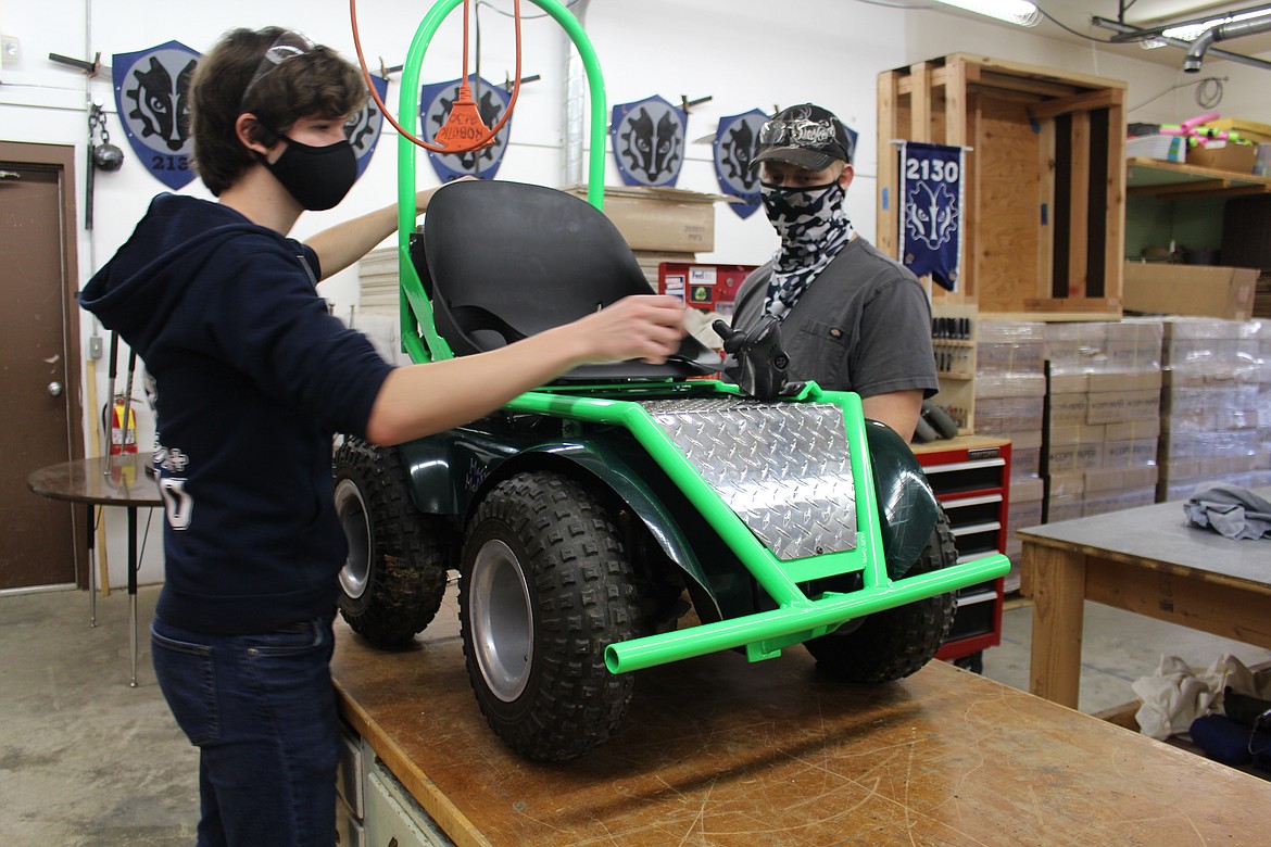 (Photo Courtesy of First Robotics Team)
Alex Stella and Bowen Thomas working on the design of the mobility scooter.