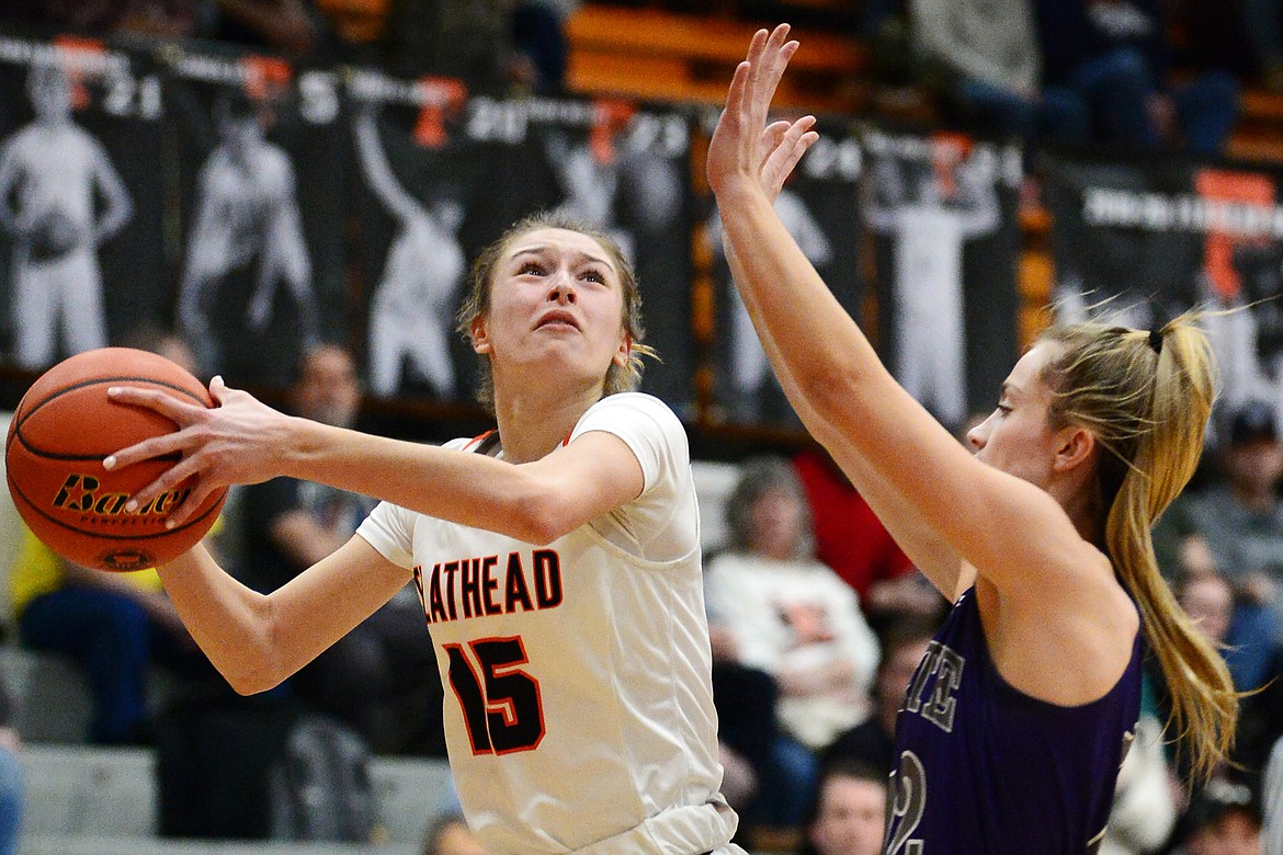 Flathead's Clare Converse (15) drives to the basket against Butte at Flathead High School on Friday. (Casey Kreider/Daily Inter Lake)