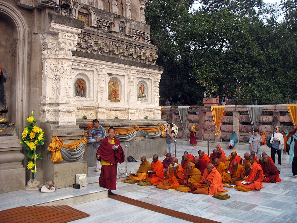 Buddhist pilgrims praying at Mahabodhi (“Great Awakening”) temple in northeast India, site of the first Bodhi Tree where Buddha attained “enlightenment.”